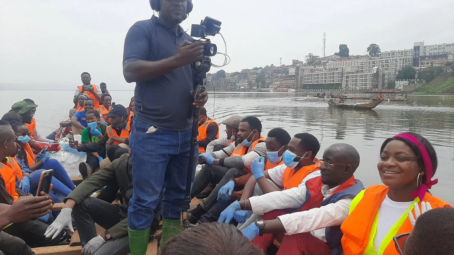 Collecting waste on Lake Kivu.