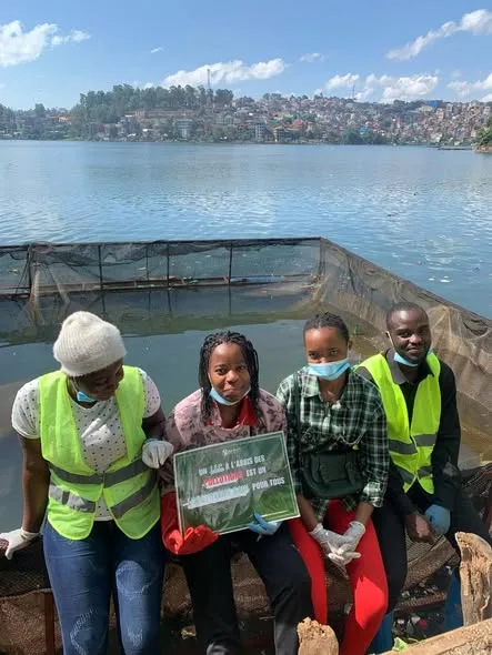 Young people's awareness message by the lake.