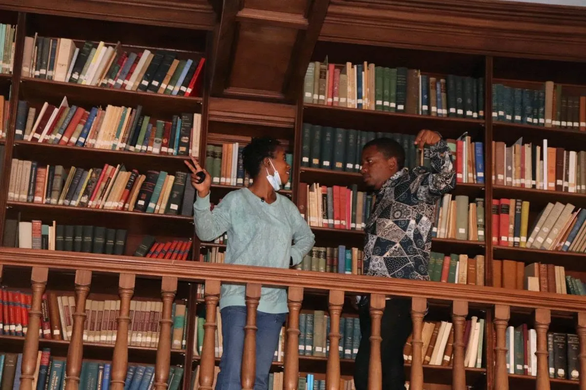 Surveying the collections on the library mezzanine.